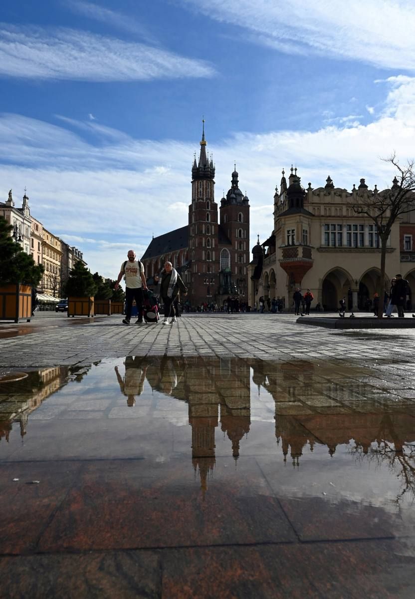 Main Market Square reflected in a puddle